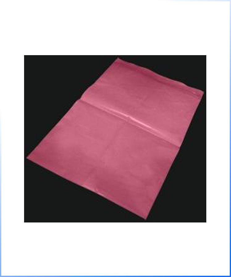 Anti-Static Bags – a single sheet of pink tissue paper is laid flat on a black surface.