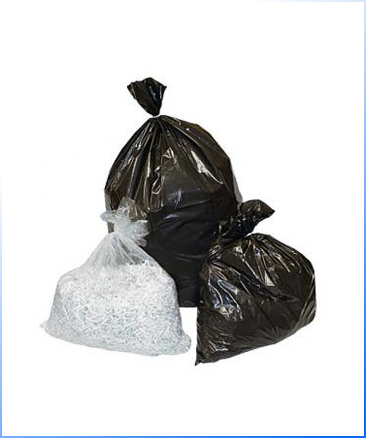 Three trash bags: two large black plastic bags and one smaller transparent bag filled with shredded paper, all tied at the top and placed on a white background.