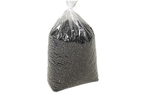 A clear plastic bag filled with black beans, tied at the top.