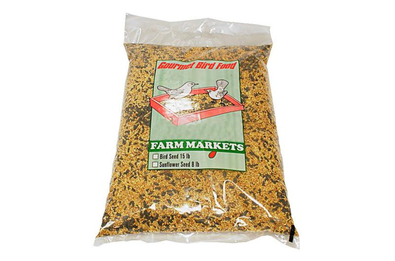 A clear plastic bag labeled "Farm Markets Gourmet Bird Food" containing mixed bird seeds, with an illustration of two birds eating from a feeder.