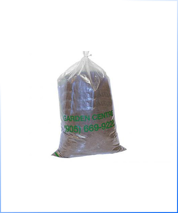 A large clear plastic bag filled with soil, labeled "GARDEN CENTRE" and a phone number in green text.