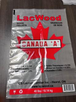 Clear plastic bag labeled "LacWood" with a red maple leaf, text "CANADA 'A'", and specifications for wood pellets; weight shown as 40 lbs / 18.14 kg.