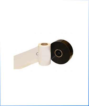 Poly Tubing – two rolls of thermal transfer ribbon, one white and one black, are shown standing side by side with a length of white ribbon unrolled.