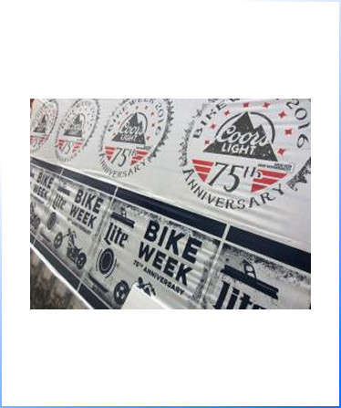 Banners display "Coors Light 75th Anniversary" and "Bike Week 75th Anniversary" logos, along with Miller Lite branding and motorcycle graphics.